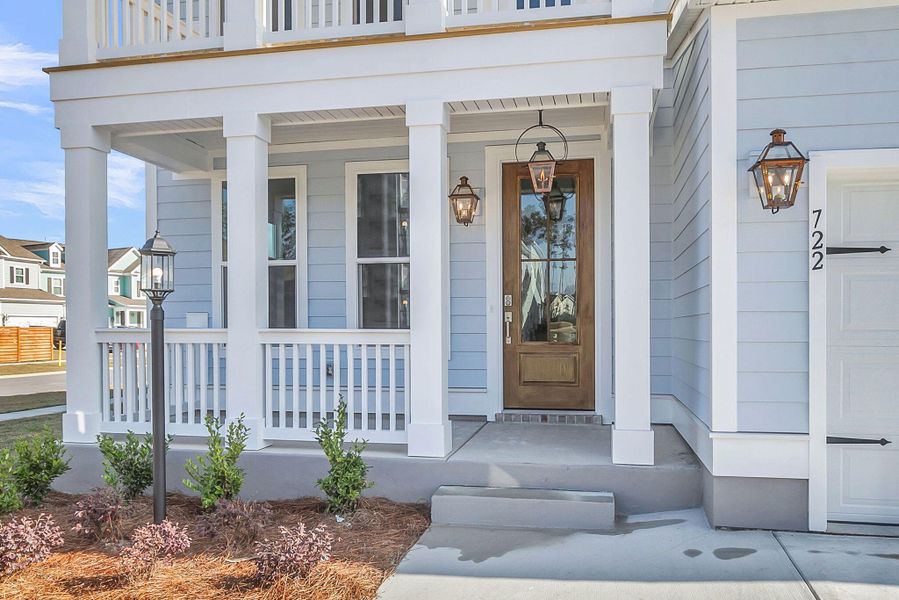 Exterior details and patio area of a home in Tidewater at Lakes of Cane Bay, Summerville (Image 3).