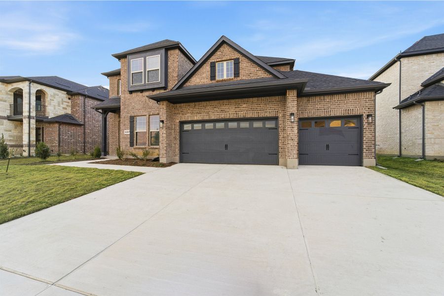 Front exterior of a new home in Green Meadows, Celina, TX, highlighting curb appeal (Image 26). Front exterior of a new home in Green Meadows, Celina, TX, highlighting curb appeal (Image 26).