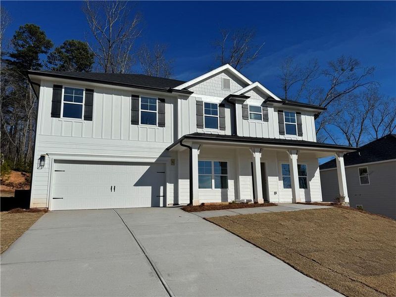 Front exterior of a new home in Thunder Ridge, Dawsonville, GA, highlighting curb appeal (Image 1). Front exterior of a new home in Thunder Ridge, Dawsonville, GA, highlighting curb appeal (Image 1).