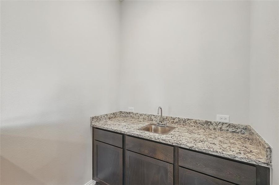 Bathroom featuring vanity and baseboards Bathroom featuring vanity and baseboards