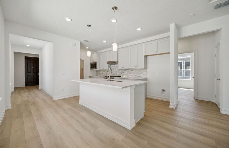 Bright kitchen with ample cabinet space Bright kitchen with ample cabinet space