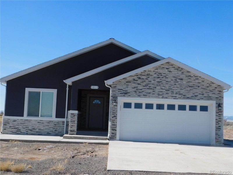 Front exterior of a new home in , Alamosa, CO, highlighting curb appeal (Image 19).