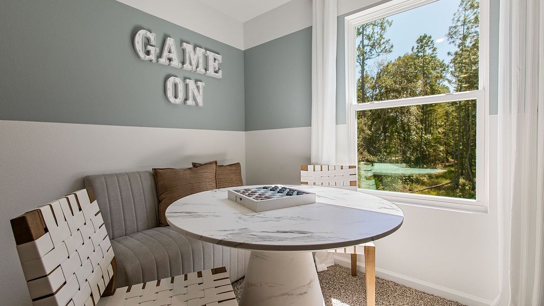 Representative furnished interior of a home built from the HAYDEN II by D.R. Horton in Copes Landing, Jacksonville (Image 26).