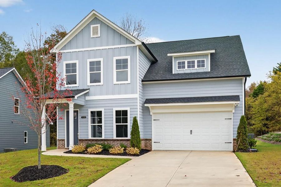 Front exterior of a new home in Red Bird Manor, Jefferson, GA, highlighting curb appeal (Image 1).