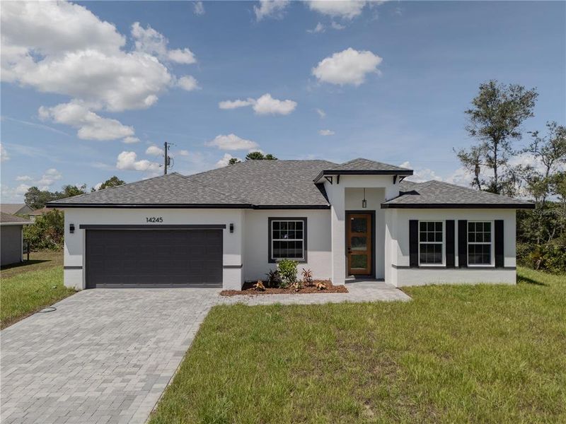 Front exterior of a new home in , Ocala, FL, highlighting curb appeal (Image 25).