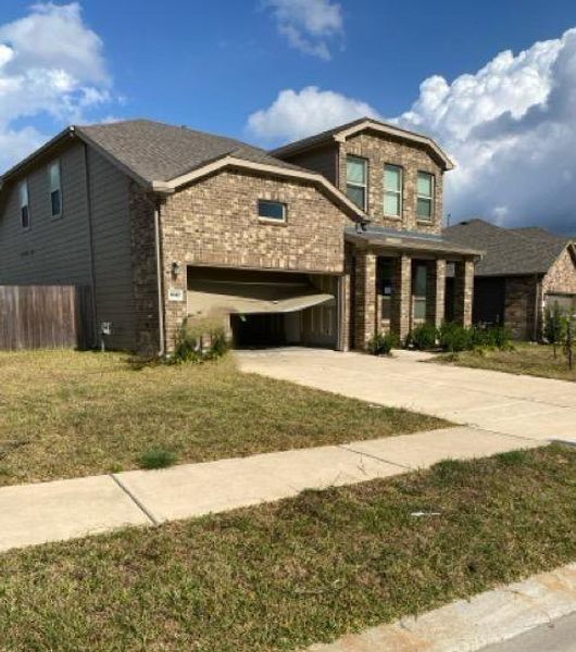 Front exterior of a new home in Myrtle Gardens, Magnolia, TX, highlighting curb appeal (Image 20). Front exterior of a new home in Myrtle Gardens, Magnolia, TX, highlighting curb appeal (Image 20).