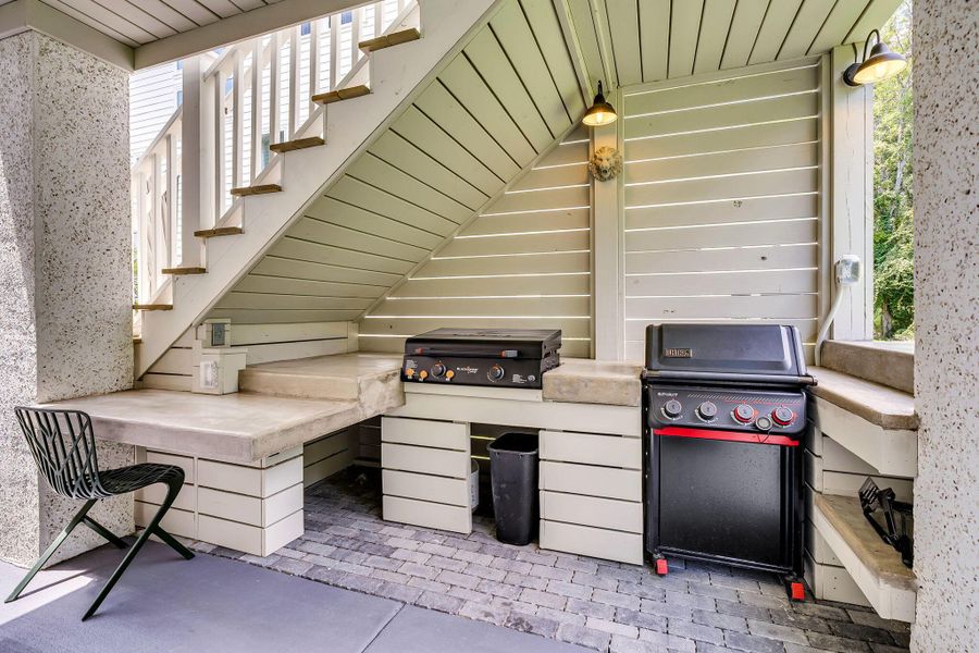 Exterior details and patio area of a home in Overlook at Copahee Sound, Awendaw (Image 34).