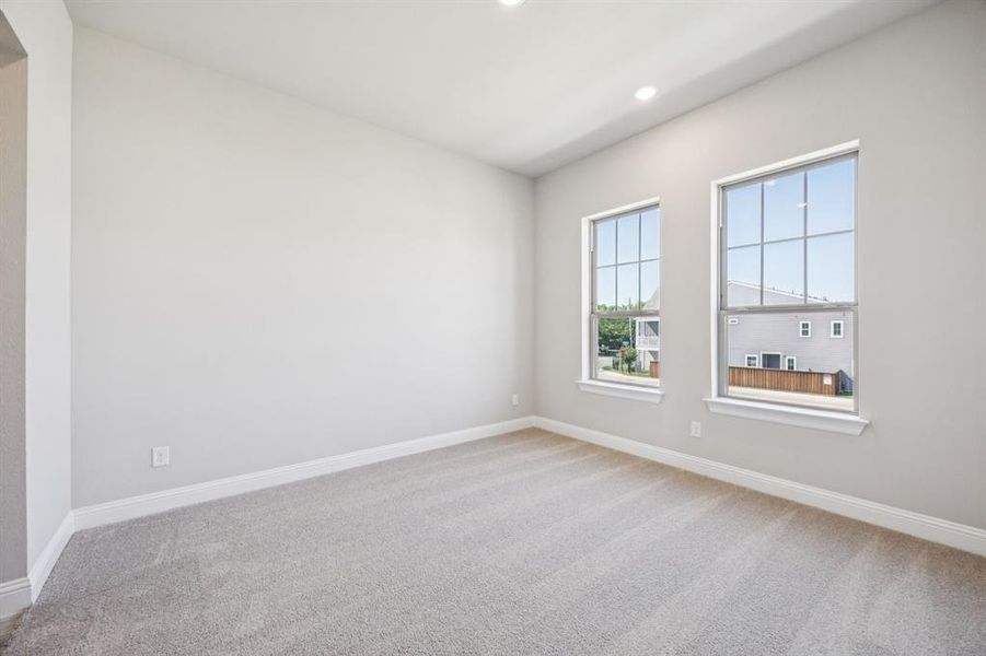 Secondary bedroom with windows allowing plenty of natural light.
