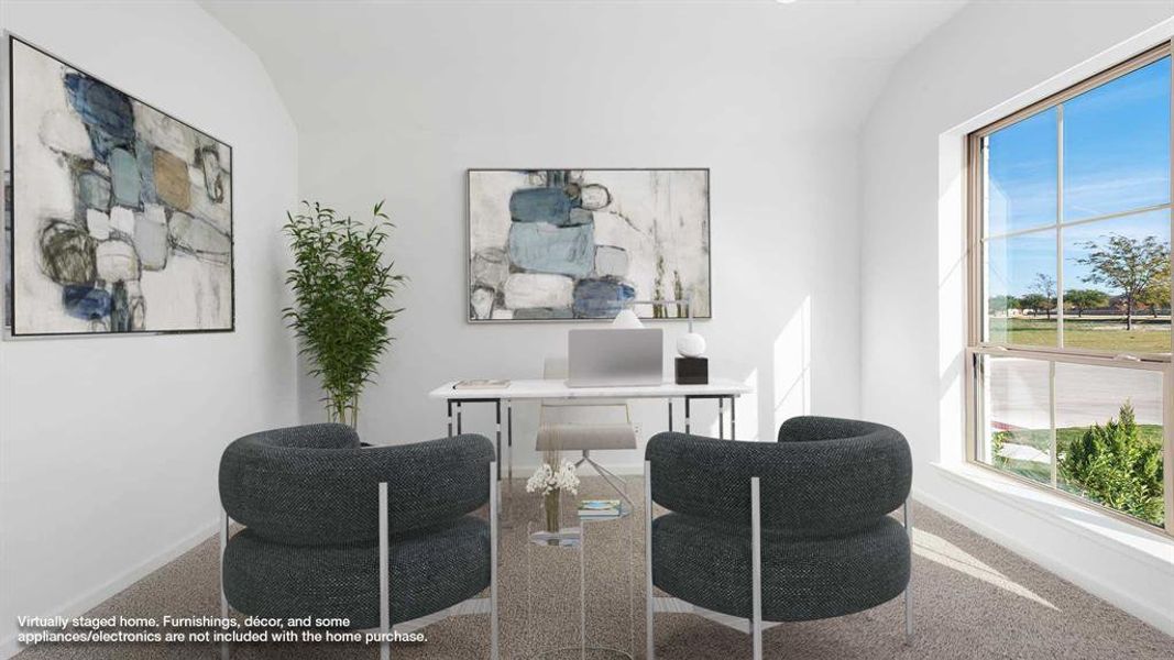 Carpeted home office with a wealth of natural light and lofted ceiling