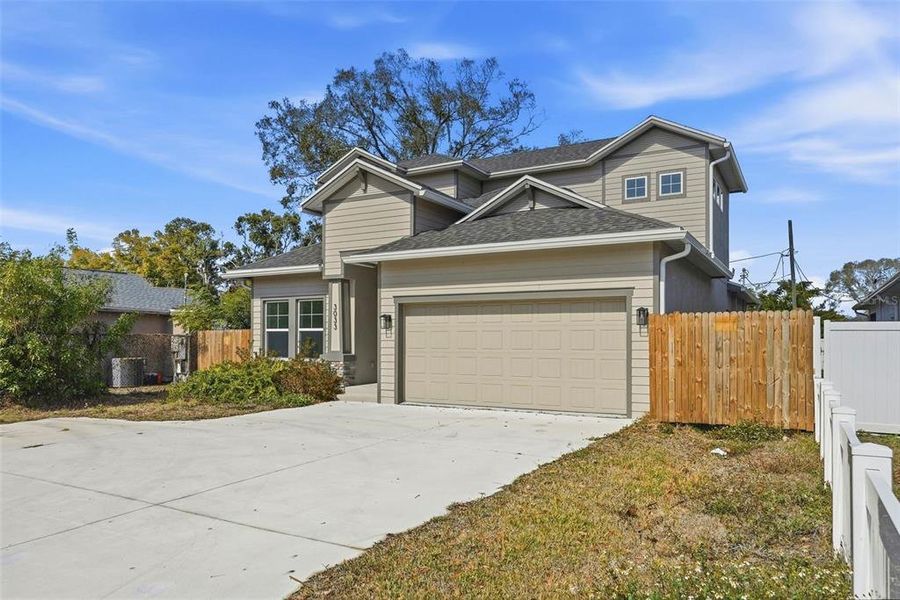 Front exterior of a new home in , St. Petersburg, FL, highlighting curb appeal (Image 16).