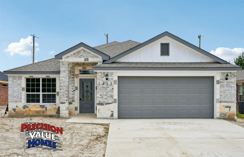 A striking facade with varied stonework and a modern garage door welcomes you home. A striking facade with varied stonework and a modern garage door welcomes you home.