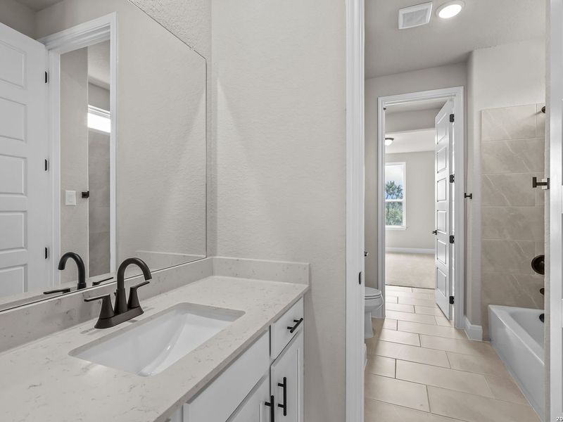 Furnished interior view inside a new home in Potranco Oaks, Castroville (Image 19).