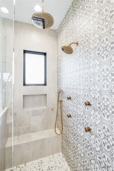 Bathroom featuring tiled shower