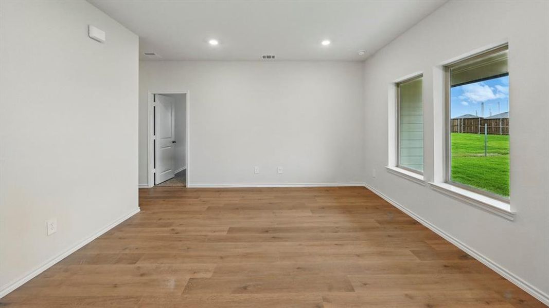 Unfurnished room with light wood-style floors and recessed lighting