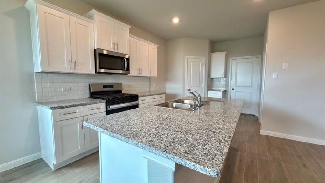 Kitchen - All Home and community information, including pricing, included features, terms, availability and amenities, are subject to change at any time without notice or obligation. All Drawings, pictures, photographs, video, square footages, floor plans, elevations, features, colors and sizes are approximate for illustration purposes only and will vary from the homes as built.