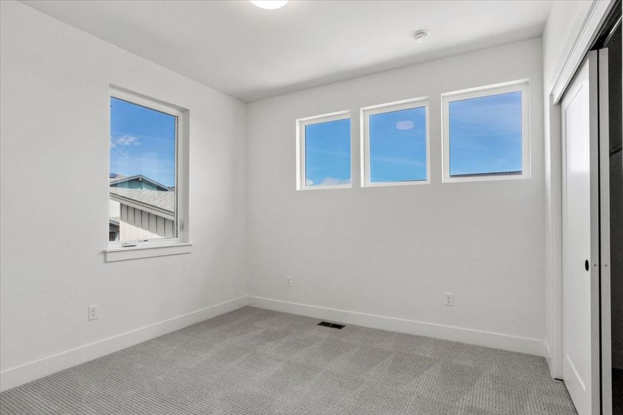 Spacious, unfurnished interior of a new home in West Grange, Longmont (Image 29).