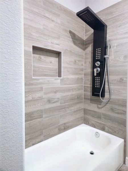 Hollywood-style bathroom, shower panel system with body jets and handheld.
