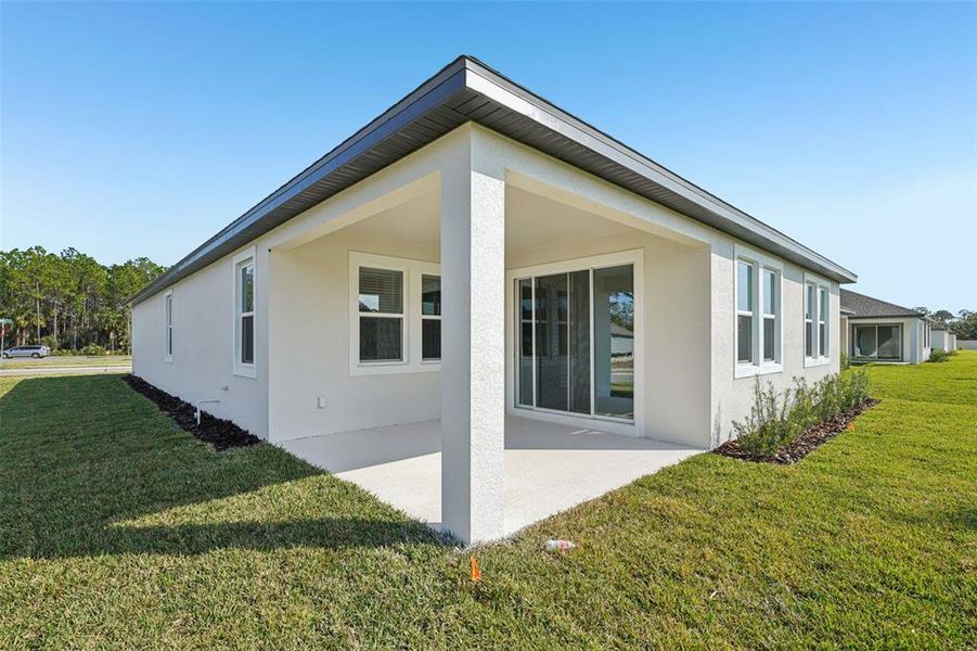 Exterior details and patio area of a home in Legends Preserve - Signature Series, Daytona Beach (Image 20). Exterior details and patio area of a home in Legends Preserve - Signature Series, Daytona Beach (Image 20).