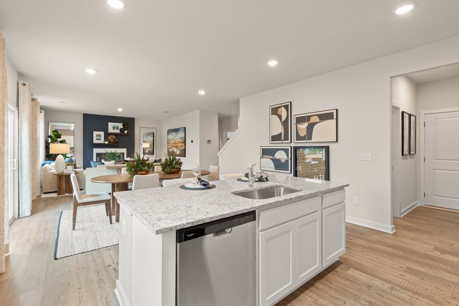 A kitchen with a marble island. A kitchen with a marble island.