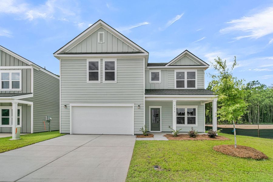 Front exterior of a new home in , Ravenel, SC, highlighting curb appeal (Image 2). Front exterior of a new home in , Ravenel, SC, highlighting curb appeal (Image 2).