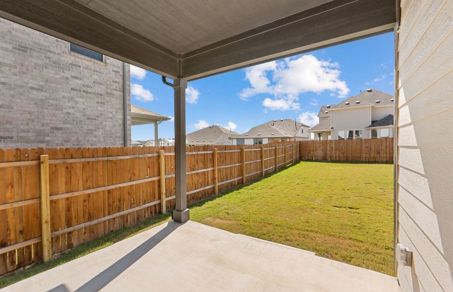 Exterior details and patio area of a home in Saddleback at Santa Rita Ranch, Liberty Hill (Image 27). Exterior details and patio area of a home in Saddleback at Santa Rita Ranch, Liberty Hill (Image 27).
