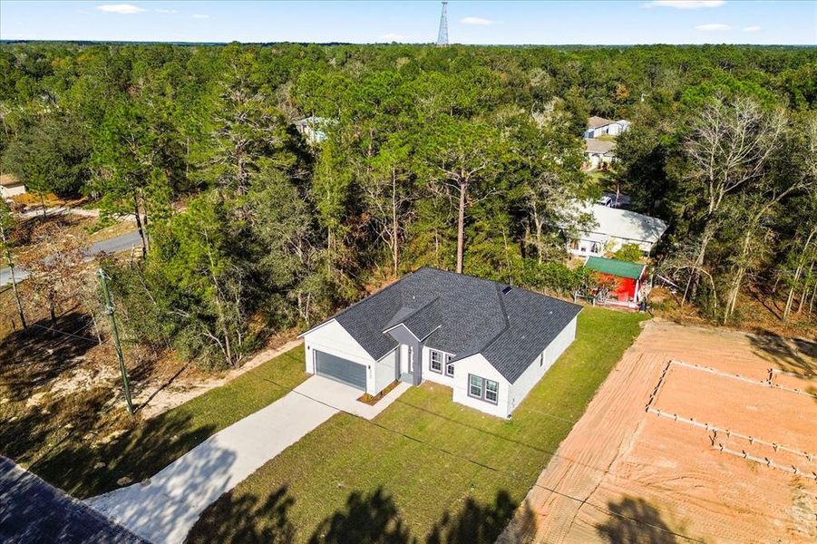 Front exterior of a new home in , Citrus Springs, FL, highlighting curb appeal (Image 2). Front exterior of a new home in , Citrus Springs, FL, highlighting curb appeal (Image 2).