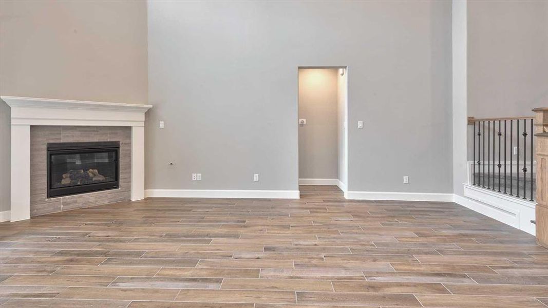 Living room featuring a tiled fireplace