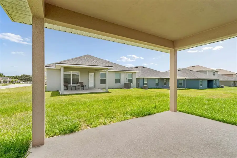 Exterior details and patio area of a home in Abbey Glen, Dade City (Image 3).