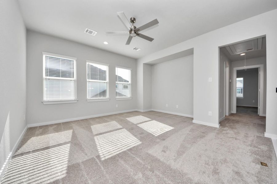 Come upstairs and enjoy a day of leisure in this fabulous game room! This is the perfect hangout spot or adult game room! Features plush carpet, high ceilings, custom paint and windows for plenty of natural light. Sample photo of completed home with similar floor plan. Actual colors and selections may vary. Come upstairs and enjoy a day of leisure in this fabulous game room! This is the perfect hangout spot or adult game room! Features plush carpet, high ceilings, custom paint and windows for plenty of natural light. Sample photo of completed home with similar floor plan. Actual colors and selections may vary.