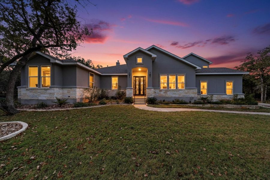 View of front of property featuring a front lawn, garden and half stucco, half masonry and French Doors View of front of property featuring a front lawn, garden and half stucco, half masonry and French Doors