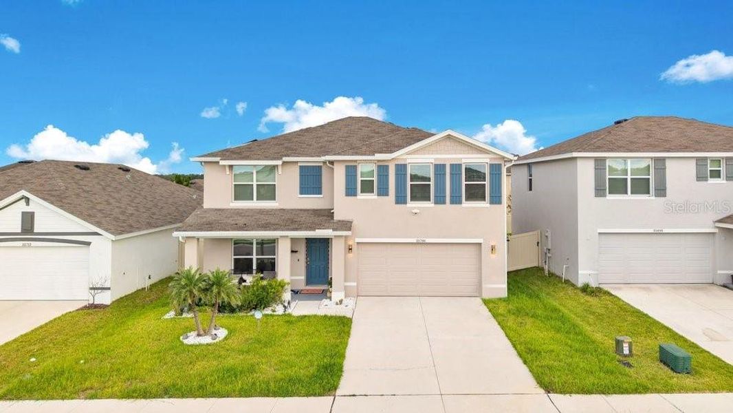 Front exterior of a new home in , Zephyrhills, FL, highlighting curb appeal (Image 21).
