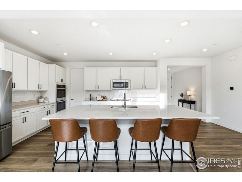 The heart of the home: a chef's kitchen designed for everyday meals, weekend cooking, and gathering around the island.