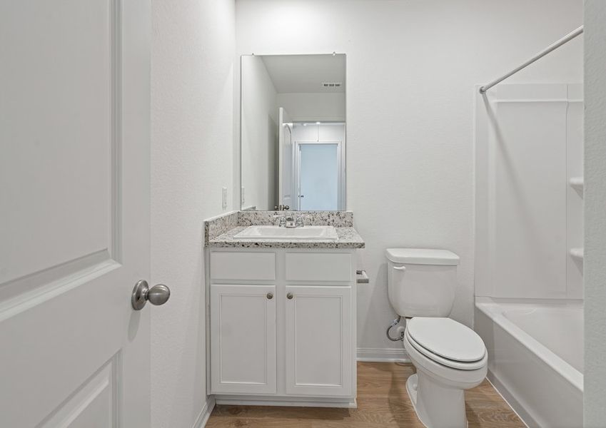 Secondary bathroom with a tub/shower combination