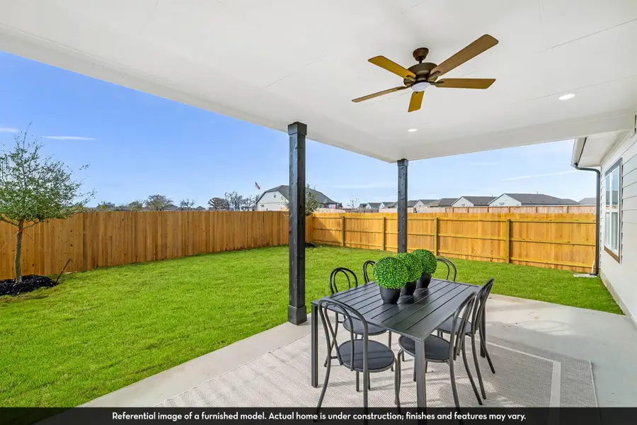 Exterior details and patio area of a home in Caney Mills, Conroe (Image 2).
