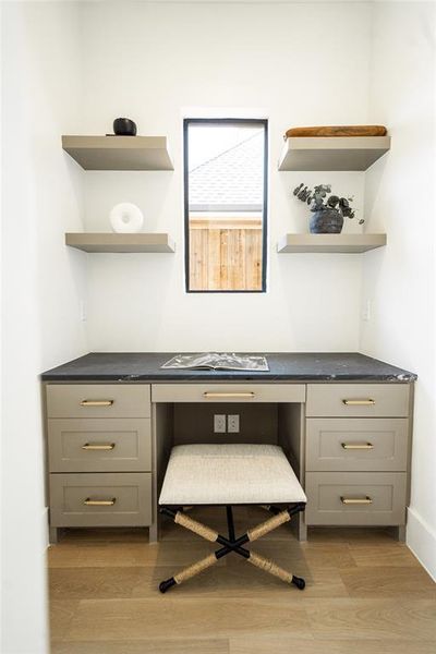 Office with light wood-type flooring