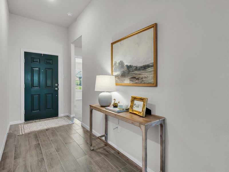 A charming painted front door adds elegance and style to your foyer.