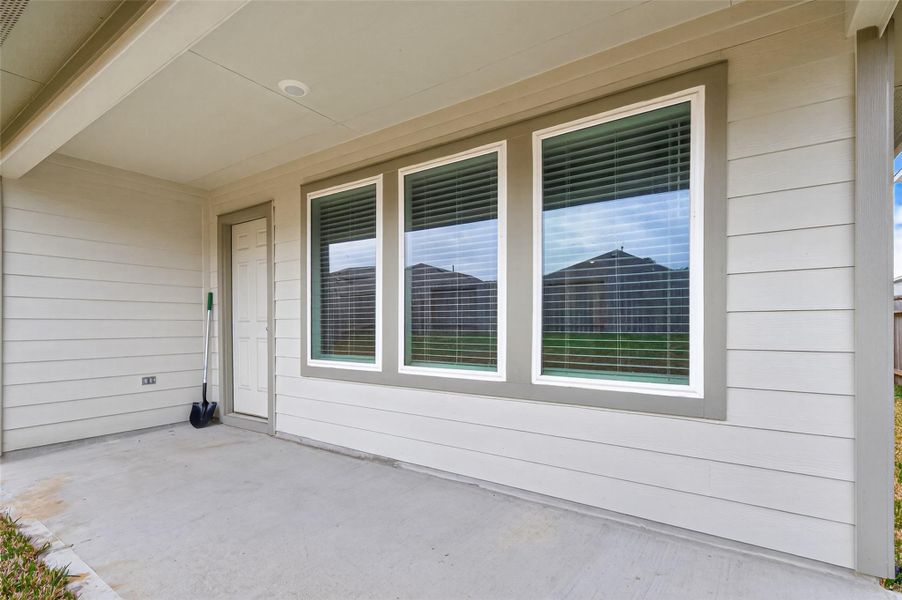 Exterior details and patio area of a home in Presswoods, Splendora (Image 29).