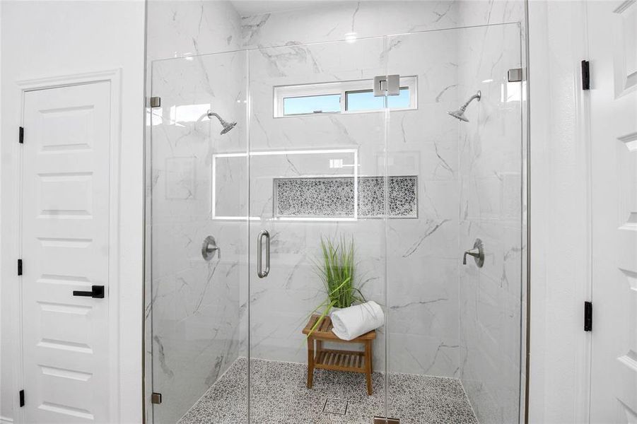 Full bathroom with a marble finish shower Full bathroom with a marble finish shower