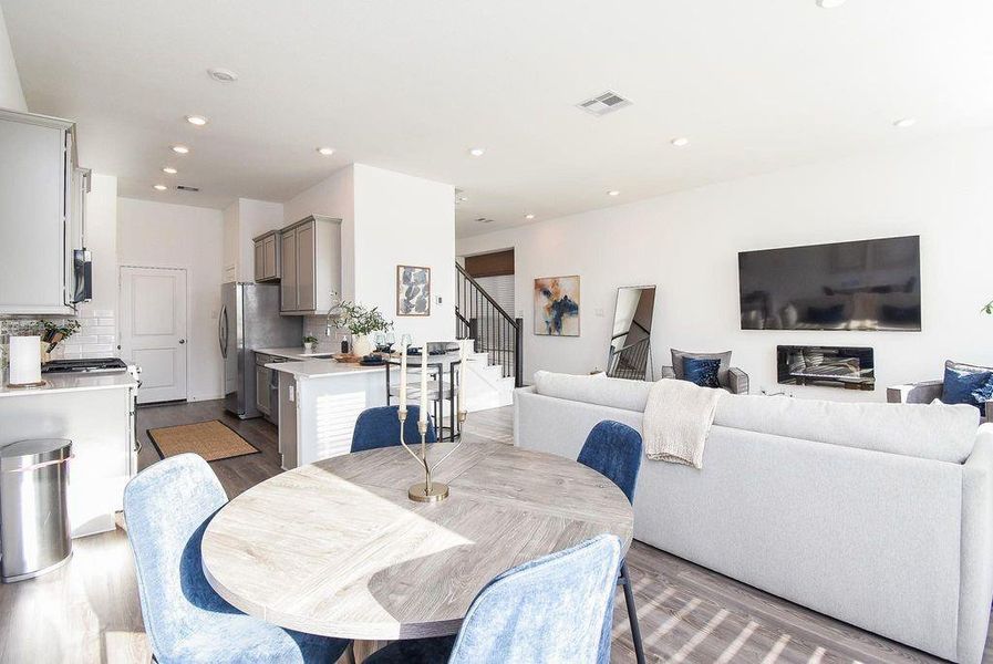 Expansive open floor plan connecting living, dining, and kitchen entertaining made effortless.