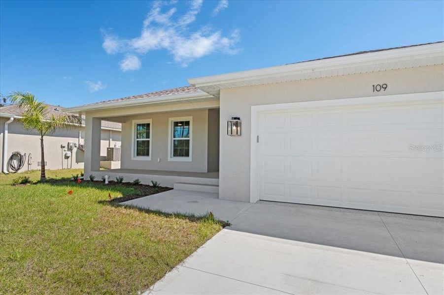 Front exterior of a new home in , Rotonda West, FL, highlighting curb appeal (Image 27). Front exterior of a new home in , Rotonda West, FL, highlighting curb appeal (Image 27).