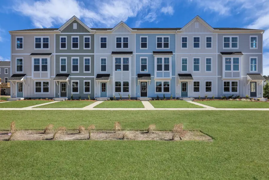 Front exterior of a new home in Westpark at Cane Bay, Summerville, SC, highlighting curb appeal (Image 1). Front exterior of a new home in Westpark at Cane Bay, Summerville, SC, highlighting curb appeal (Image 1).