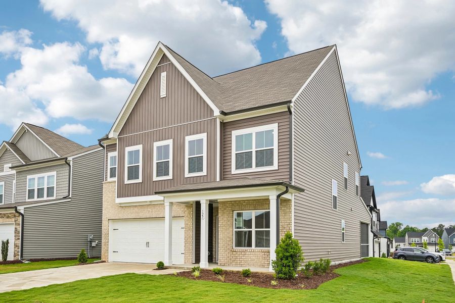 Front exterior of a new home in Crescent Mills, Wilson's Mills, NC, highlighting curb appeal (Image 1). Front exterior of a new home in Crescent Mills, Wilson's Mills, NC, highlighting curb appeal (Image 1).