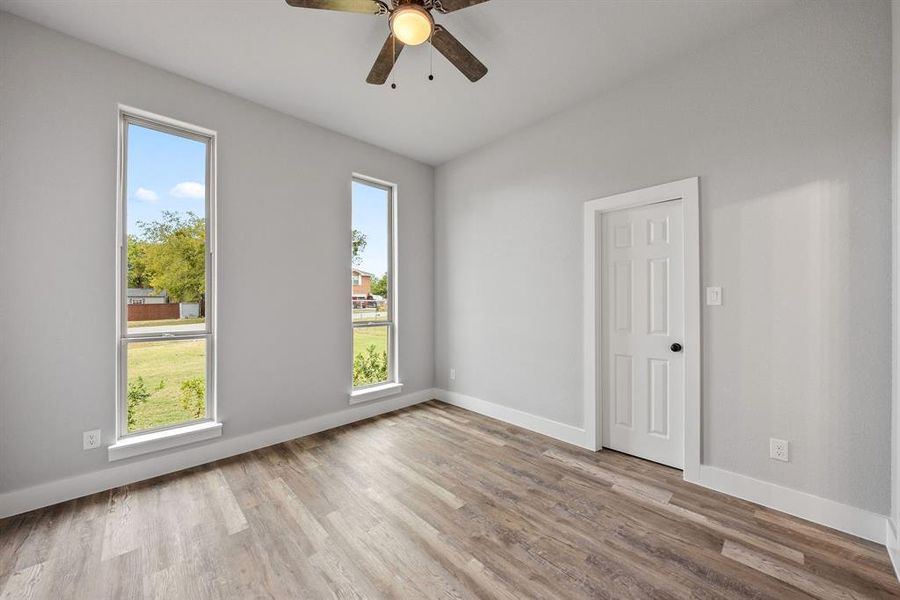 Spare room featuring light wood-style floors and ceiling fan