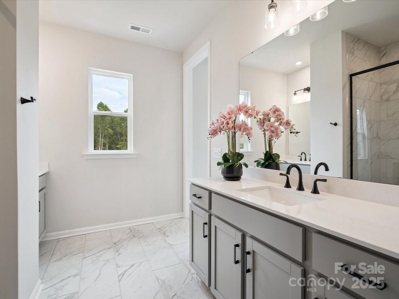 Split Dual Vanity at Primary En Suite Bath.  *Model Photos | Actual Finishes, Structural Selections, and Orientation May Vary.