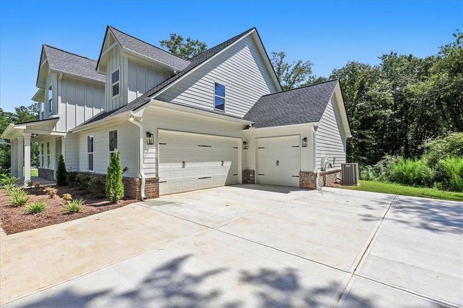 Front exterior of a new home in , Monroe, GA, highlighting curb appeal (Image 34).