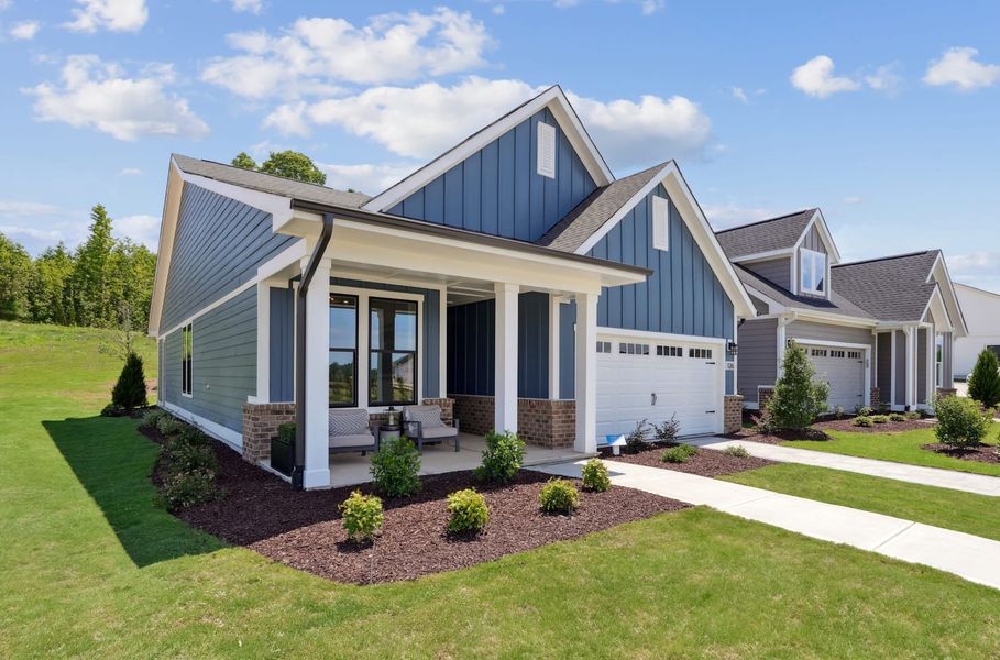 Representative exterior photo of a completed home built from the Hickory Hill by Tri Pointe Homes in Altis At Serenity | A 55+ Community, Fuquay Varina, NC (Image 2). Representative exterior photo of a completed home built from the Hickory Hill by Tri Pointe Homes in Altis At Serenity | A 55+ Community, Fuquay Varina, NC (Image 2).