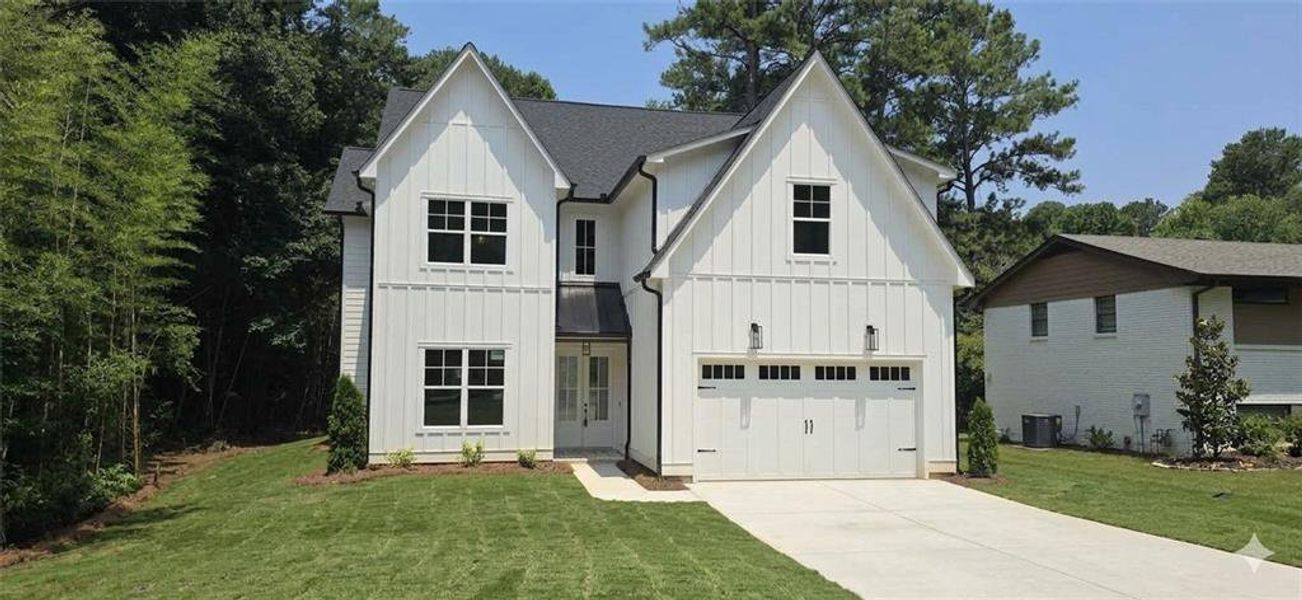 Front exterior of a new home in , Marietta, GA, highlighting curb appeal (Image 1). Front exterior of a new home in , Marietta, GA, highlighting curb appeal (Image 1).