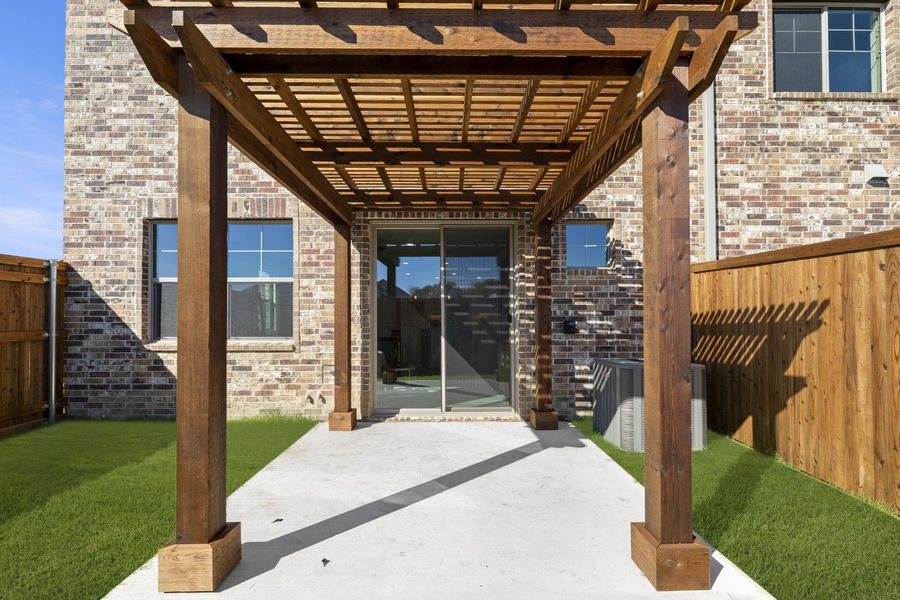 Exterior details and patio area of a home in Wildridge, Oak Point (Image 4).