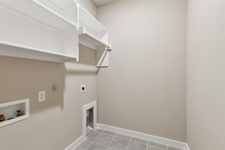 Utility room in the Elm home plan by Trophy Signature Homes – REPRESENTATIVE PHOTO