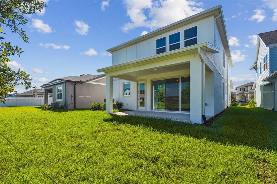 Exterior details and patio area of a home in Chapel Crossings - Garden Series, Wesley Chapel (Image 20).